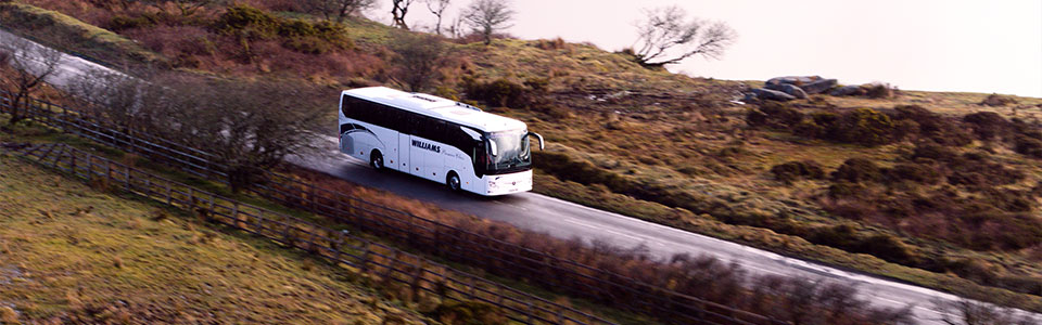 Photograph of Williams Travel coach on the move - Microcomms Professional Services case study for switching wifi to fibre for more reliable connection