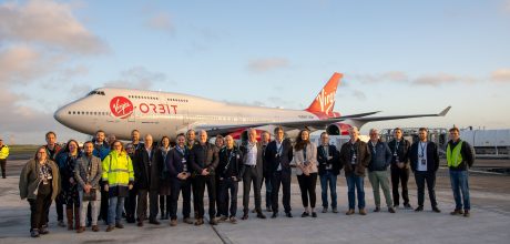 Simon - Managing Director from Microcomms Professional Services at Spaceport Cornwall with Spaceport team, standing in front of Virgin Orbit aeroplane at Newquay