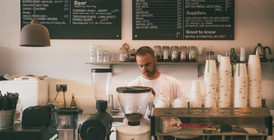 Man making coffee in a coffee shop