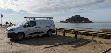 Microcomms van parked at Marazion with St Michael's Mount in background.