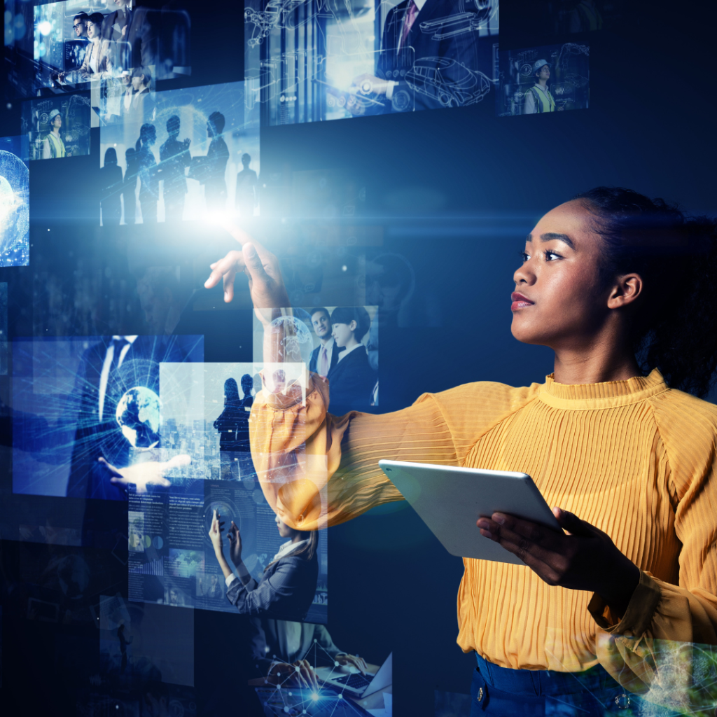 Lady stood in front of a digital board of screens floating